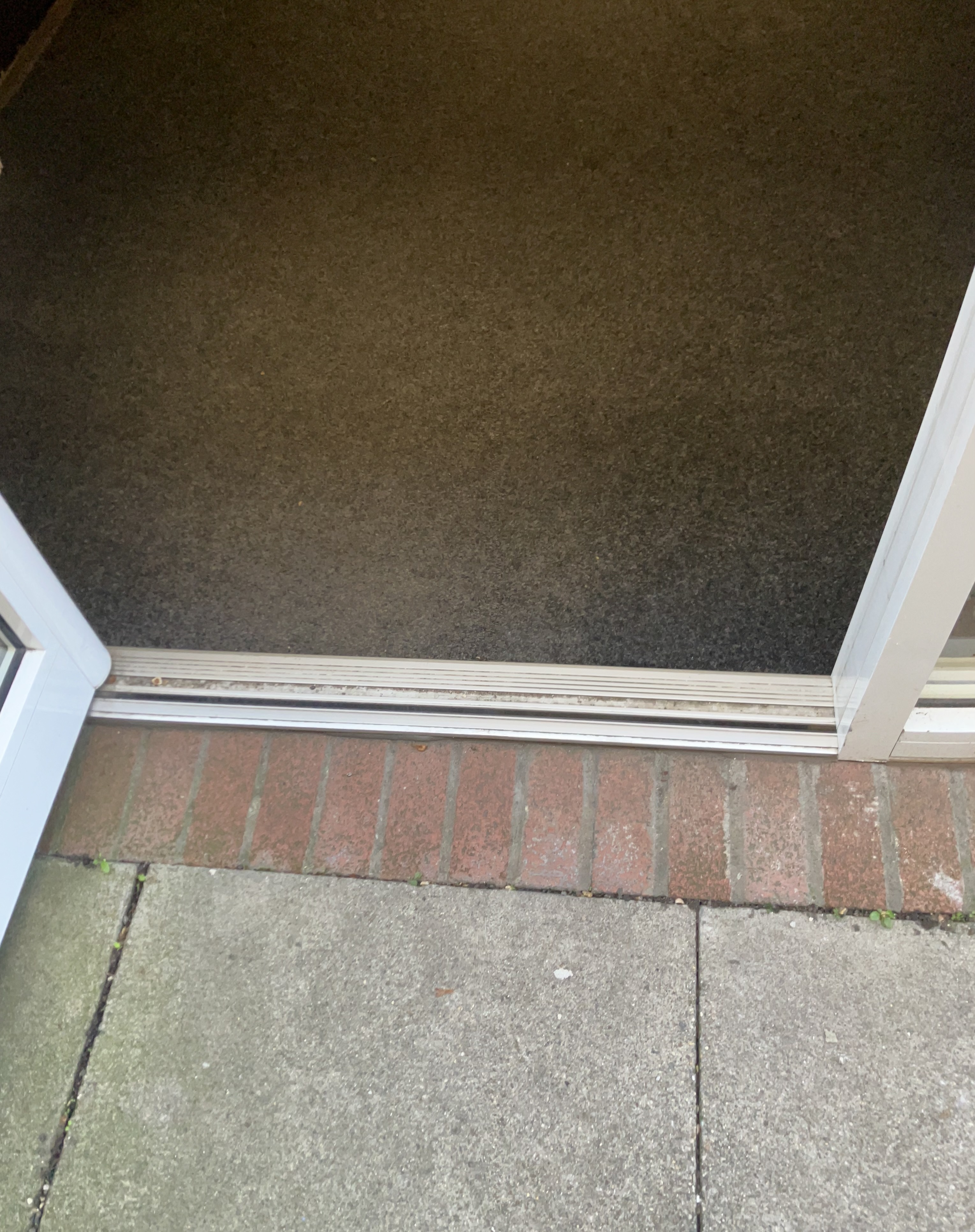There is a small lip at the foot of the front door.